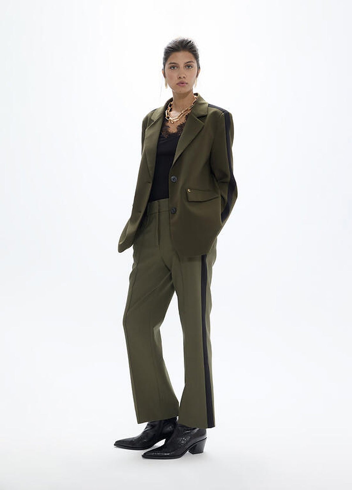 https://cdn.shopify.com/s/files/1/0368/5521/8235/files/olives-restored-aw26-lola-casademunt-trousers-san-sebastian-lf2614026-01.jpg?v=1792433118